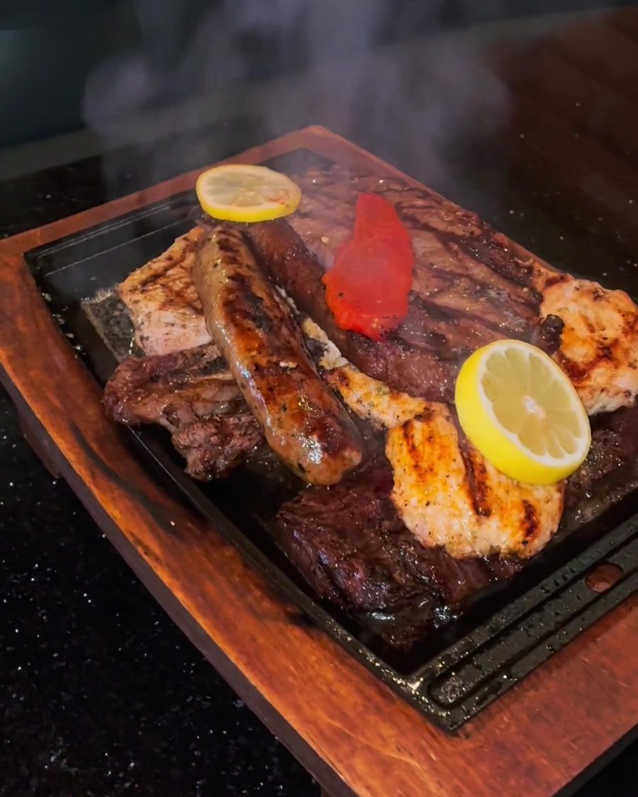 A sizzling Parrillada on a wooden board